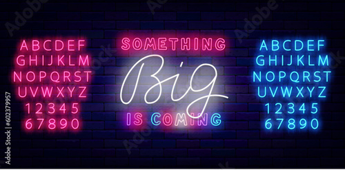 Something big is coming neon sign. Colorful handwrittetn text. Special offer label. Vector illustration