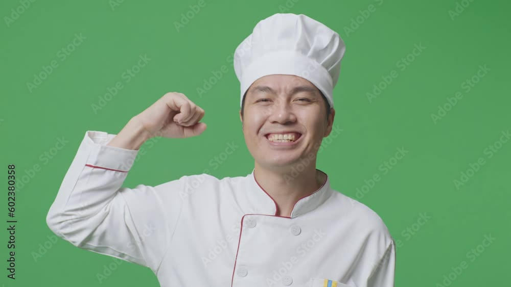 Close Up Of Asian Man Chef Smiling And Flexing His Bicep While Standing In The Green Screen Background Studio
Close Up Of Asian Man Chef Smiling And Flexing His Bicep While Standing In The Green Screen Background Studio