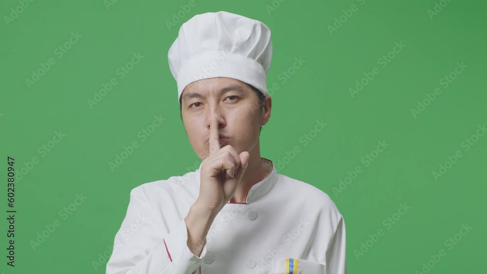 Close Up Of Asian Man Chef Looking At Camera And Making Shh Gesture In The Green Screen Background Studio
Close Up Of Asian Man Chef Looking At Camera And Making Shh Gesture In The Green Screen Background Studio