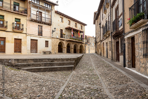 Fototapeta Naklejka Na Ścianę i Meble -  a cobbled street with traditional houses in Frías town, Las Merindades, province of Burgos, Castile and León, Spain