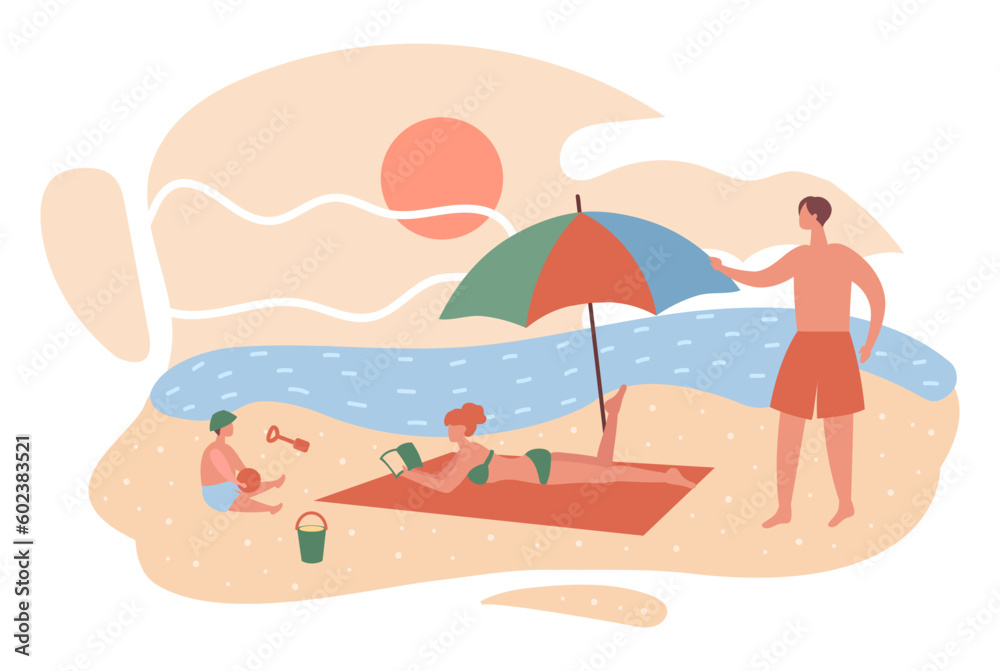 Family relaxing on the beach by the sea