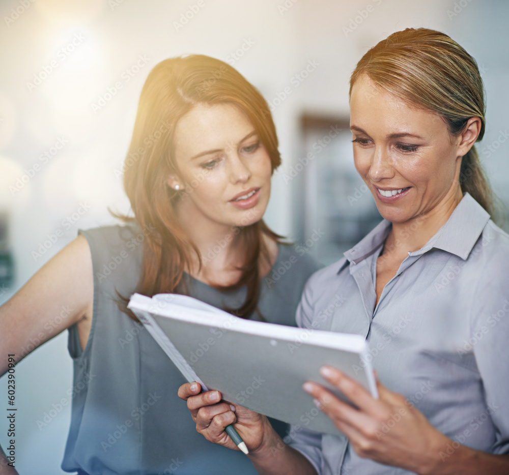 Collaboration, notebook and planning with a business team doing research together in an office at work. Teamwork, strategy or corporate partnership with women employees or colleagues working on paper