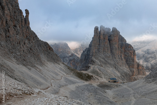 View of vajolet towers (torri del Vajolet) and refuge Re Alberto I from Santner's pass, Dolomites, Italy photo