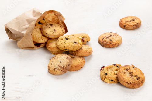Vászonkép National Cookie Day with yummy freshly chocolate chip cookies on a white background
