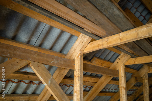 attic room with roof rafters of a wooden house