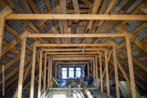 attic room with roof rafters of a wooden house
