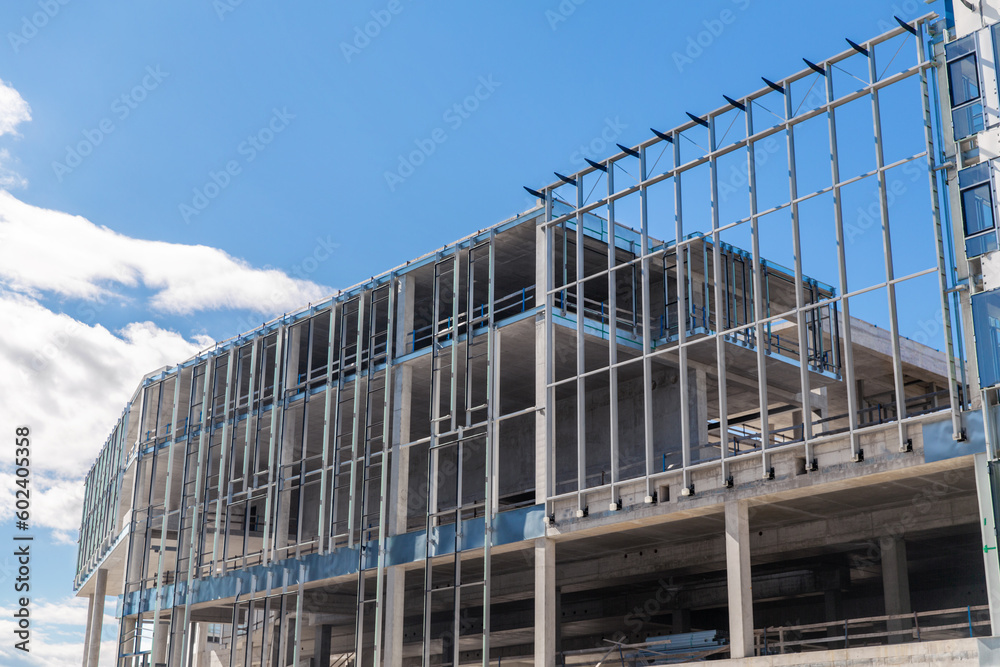 architecture and site concept - modern building construction over blue sky