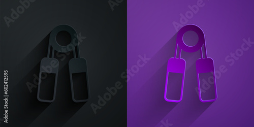 Paper cut Sport expander icon isolated on black on purple background. Sport equipment. Paper art style. Vector