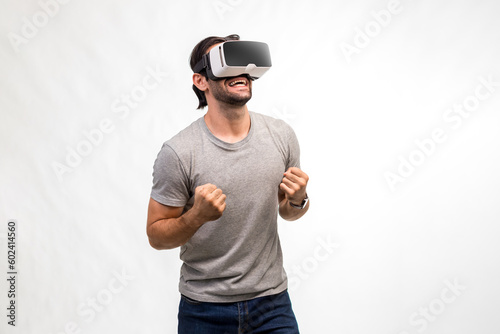 Man in VR headset. Man using VR glasses for online game. Handsome man using virtual reality headset. man experience virtual reality via VR headset and touching something with hands.