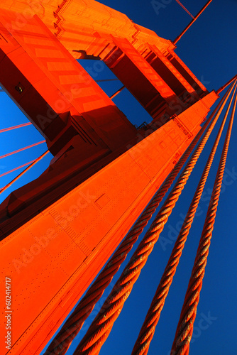 The orange anchor of the Golden Gate Bridge in San Francisco contrasts with the blue sky