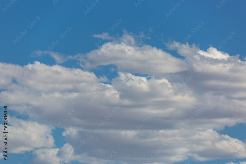 Pretty clouds in the sky. Blue sky with dramatic and or unusual cloud formations. Gorgeous cloudscape, Sonoran Desert heavens.