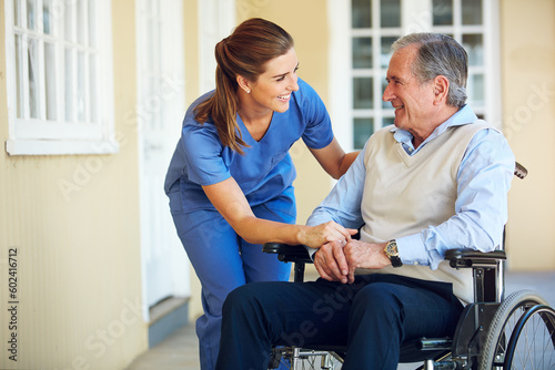 Bilde på lerret Speaking, happy caregiver or old man in wheelchair in hospital helping an elderly patient for support in clinic