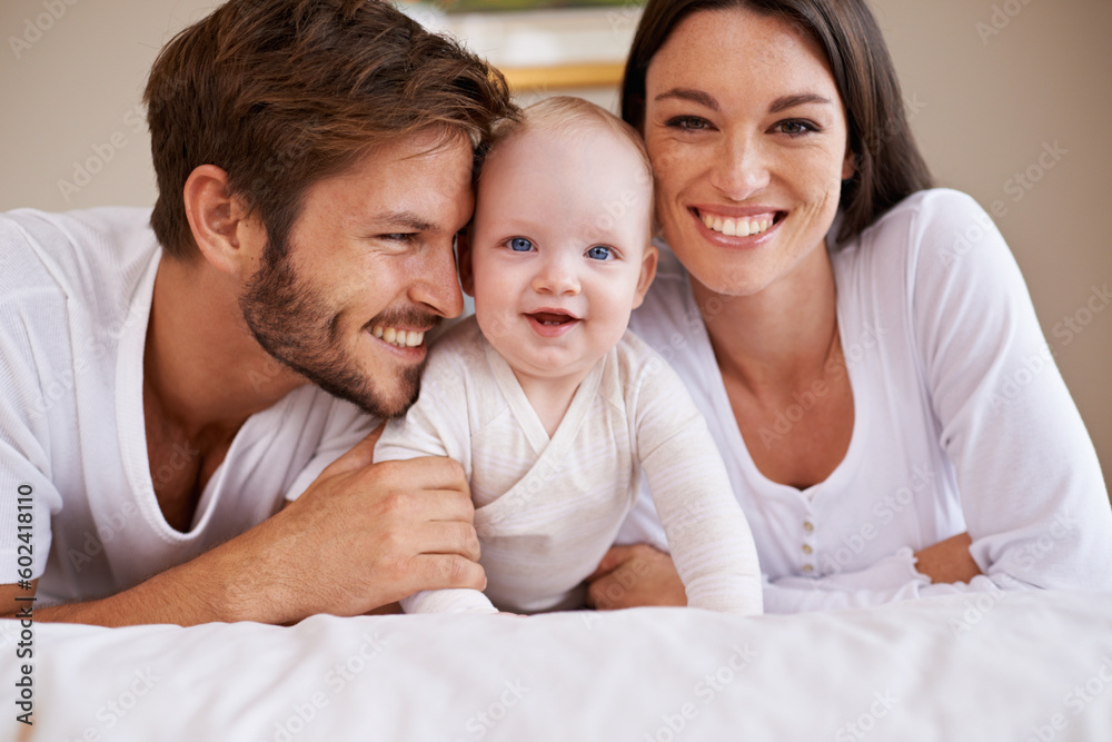 Portrait, happy family and parents with baby on bed for love, care and quality time together at home. Mother, father and newborn child relaxing in bedroom for development, caring support or happiness