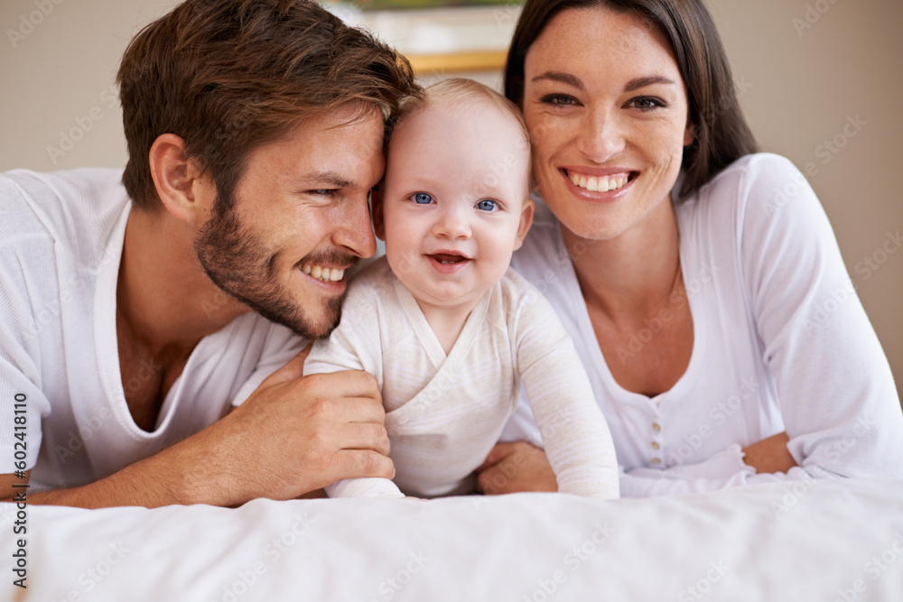 Portrait, happy family and parents with baby on bed for love, care and quality time together at home. Mother, father and newborn child relaxing in bedroom for development, caring support or happiness Portrait, happy family and parents with baby on bed for love, care and quality time together at home. Mother, father and newborn child relaxing in bedroom for development, caring support or happiness