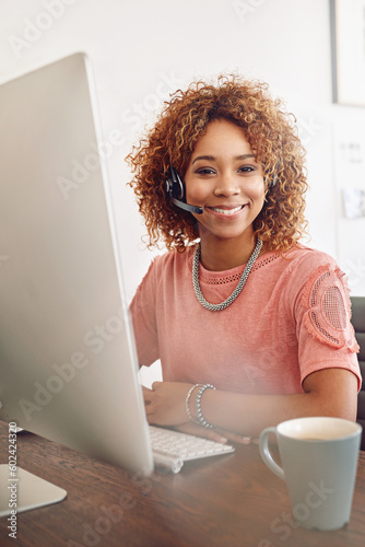 Call center, happy woman and portrait of consultant at computer, help desk and customer services. African telemarketing agent smile for online consulting, telecom administration and technical support photo