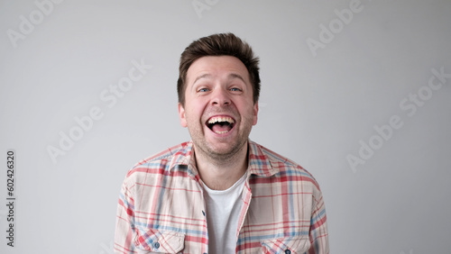Konstfotografi European funny young man is laughing loudly. Positive emotion