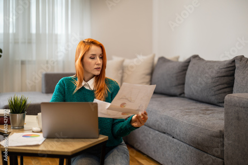Woman using laptop, writing email,online meeting or payment online