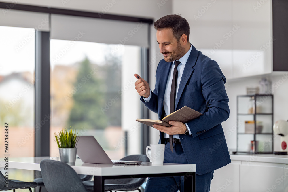 Businessman using laptop at his office desk Businessman using laptop at his office desk