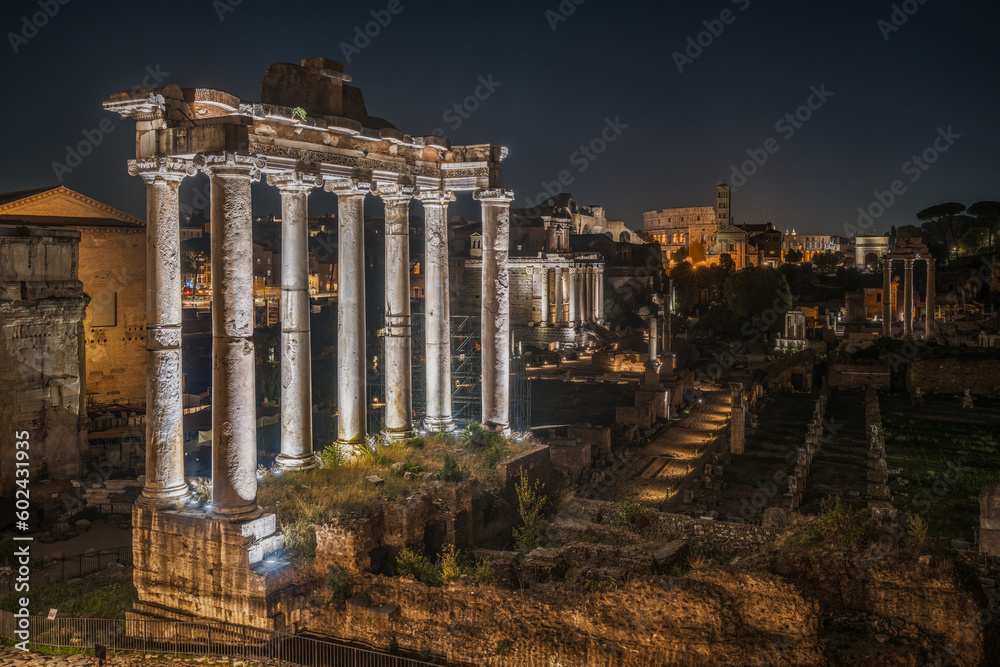 Night view of Roman Forum and the Colosseum with scenic lighting, Rome, Italy