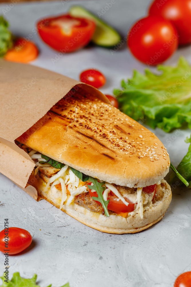 panini sandwich with crispy chicken and rucola salad