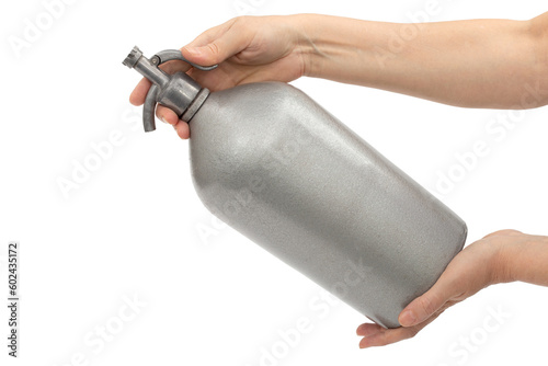 Tableau sur toile Women's hands are holding siphon with soda water, isolated on white background
