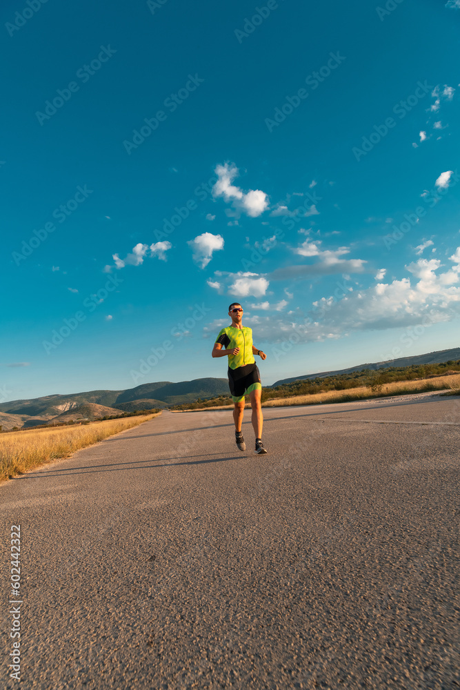 Triathlete in professional gear running early in the morning, preparing for a marathon, dedication to sport and readiness to take on the challenges of a marathon. Triathlete in professional gear running early in the morning, preparing for a marathon, dedication to sport and readiness to take on the challenges of a marathon.