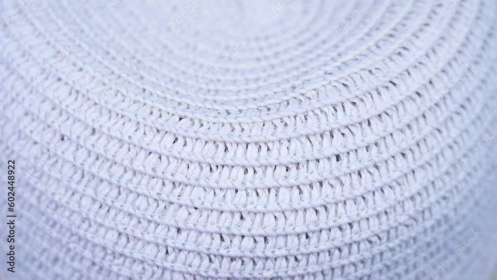 fashionable straw hat of white colour with small holes fashionable straw hat of white colour with small holes