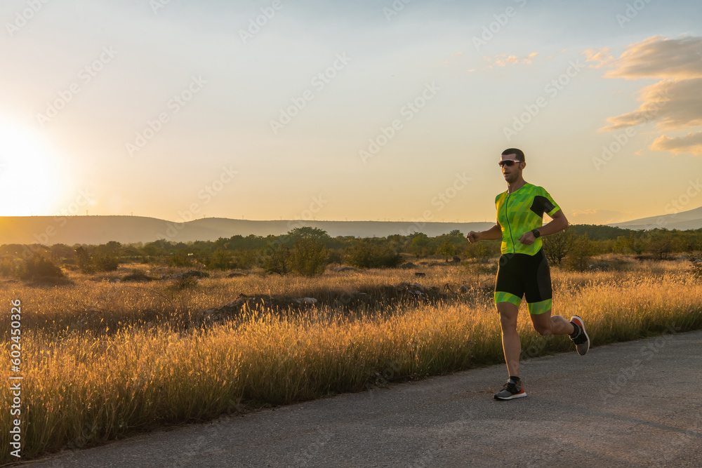 Triathlete in professional gear running early in the morning, preparing for a marathon, dedication to sport and readiness to take on the challenges of a marathon. 