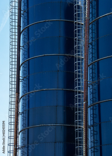 two storage tanks and ladders