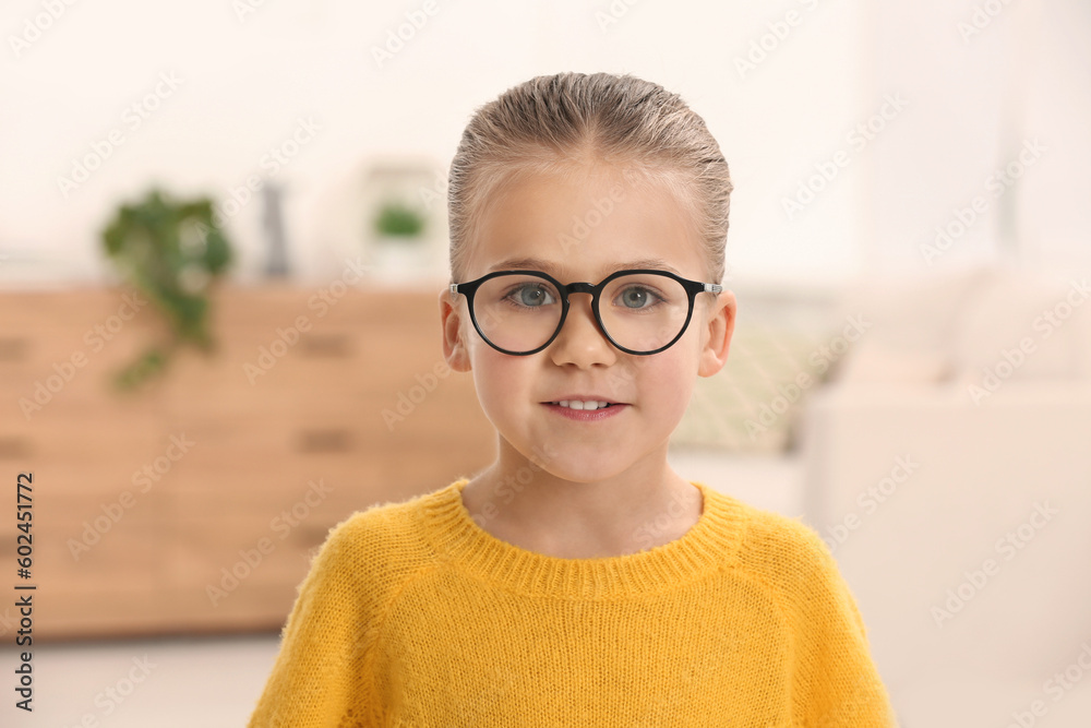 Portrait of cute little girl wearing glasses indoors Portrait of cute little girl wearing glasses indoors