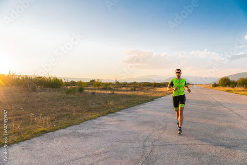 Triathlete in professional gear running early in the morning, preparing for a marathon, dedication to sport and readiness to take on the challenges of a marathon. 