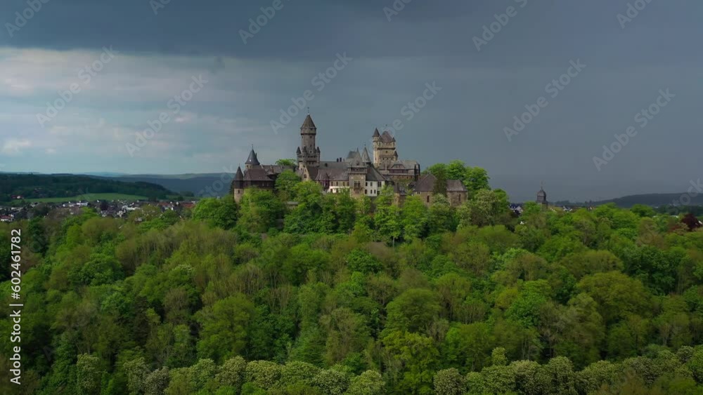 Aerial drone view medieval neo-gothic Braunfels castle on top of hill on gloomy rainy day. Hessen, Germany. High quality 4k footage Aerial drone view medieval neo-gothic Braunfels castle on top of hill on gloomy rainy day. Hessen, Germany. High quality 4k footage