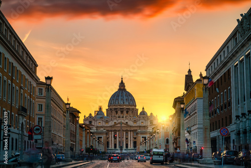 St. Peter's basilica at sunset viewed across Via della Conciliazione street 