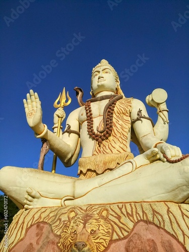 The Large Statue of Lord Shiva in the city of Nageshwar near the Dwarka district of Gujarat in India photo