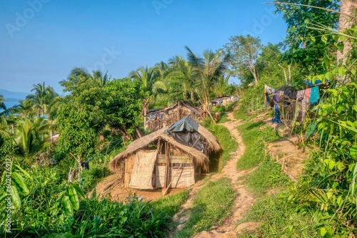 A small village of thatched huts in an indigenous Mangyan tribal community on a hillside on Mindoro Island, Philippines. The small homes have no electricity or running water.