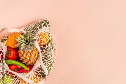 Fresh vegetables and fruits in bag mesh.