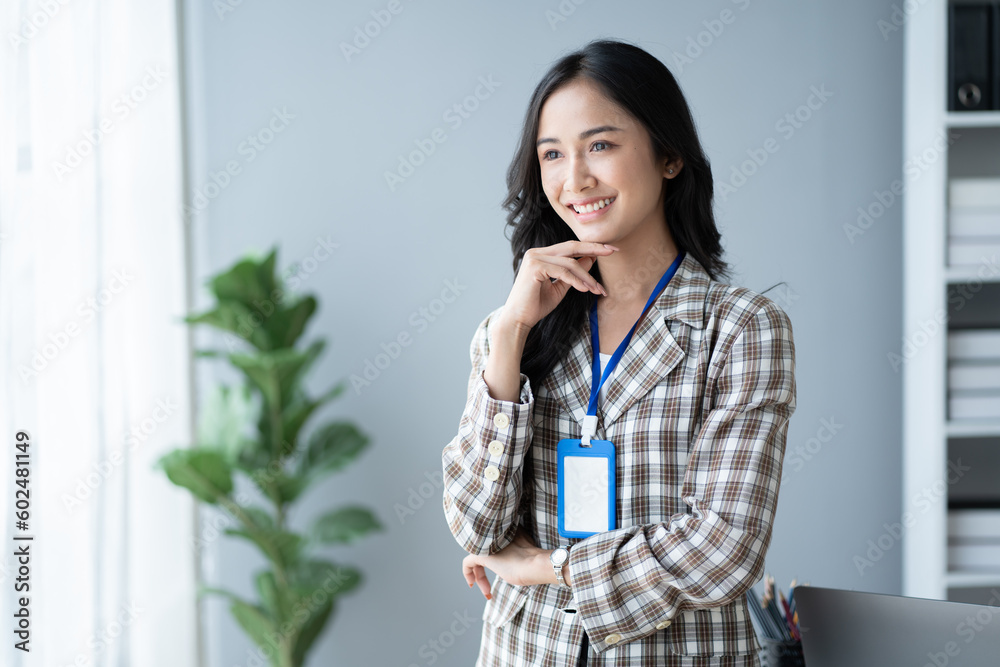Portrait of beautiful and confident Asian businesswoman standing in the modern office room. Portrait of beautiful and confident Asian businesswoman standing in the modern office room.