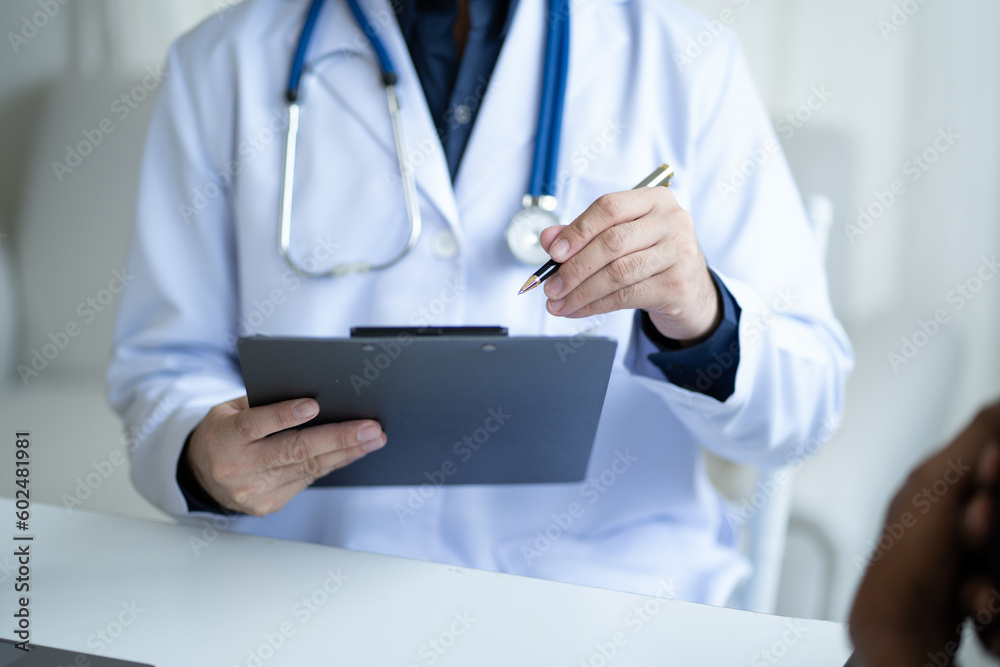 Close up view of professional physician consulting with male patient, talking to male client at medical checkup visit