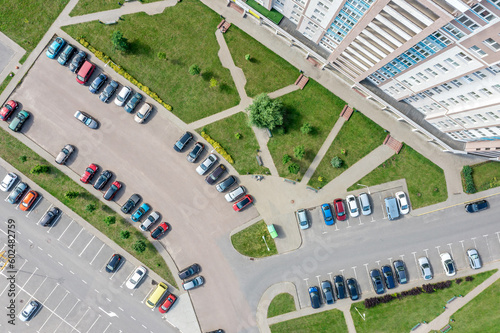 aerial top view of outdoor parking lot near new residential house. drone photo looking down.