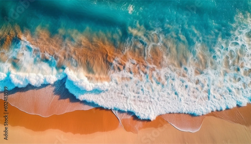 Ocean waves on the beach as a background. Amazing natural summer vacation holidays background. Aerial top down view of beach and sea with blue water