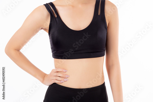 Closeup waist and abdomen of asian woman beautiful with slim isolated on white background, closeup belly with workout and exercise for slim and weightloss with diet, health and wellbeing concept.