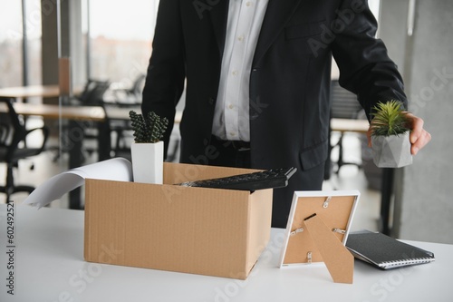 Portrait of sad dismissed senior old business man worker taking his office supplies in the box. Pensioner mature retire from work carry staff back home. Lifestyle business retirement, quit job concept © Serhii