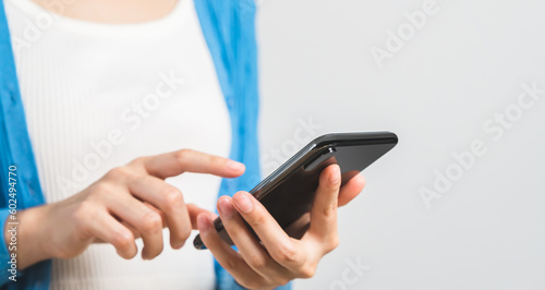 woman hand holding smartphone on white background.