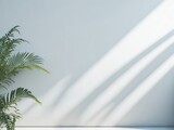 Minimalistic light background with blurred foliage shadow on a wall