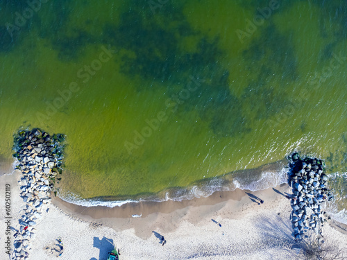 Obraz na płótnie Aerial view landscape Poland Gdynia. View of beach and Baltic sea, sand, stones. Photo from a drone. w salonie