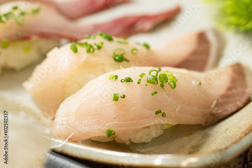 White fish sushi on a plate