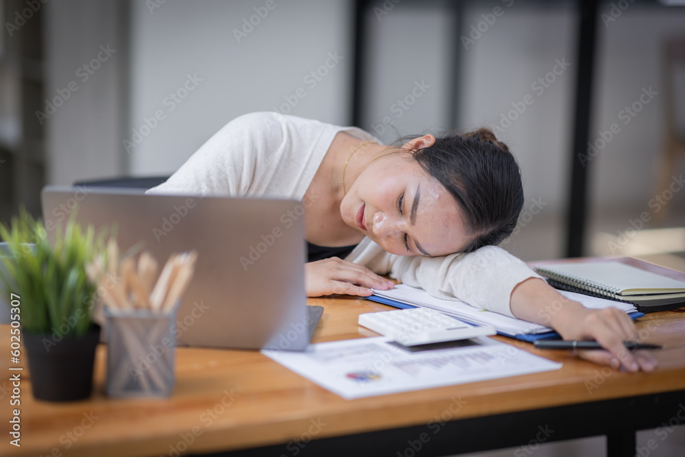 Portrait of tired young business Asian woman work with documents tax laptop computer in office. Sad, unhappy, Worried, Depression, or employee life stress concept
Portrait of tired young business Asian woman work with documents tax laptop computer in office. Sad, unhappy, Worried, Depression, or employee life stress concept