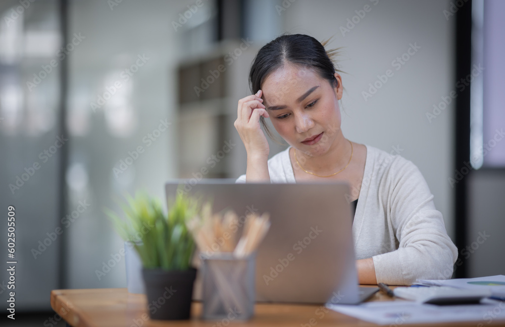 Portrait of tired young business Asian woman work with documents tax laptop computer in office. Sad, unhappy, Worried, Depression, or employee life stress concept
Portrait of tired young business Asian woman work with documents tax laptop computer in office. Sad, unhappy, Worried, Depression, or employee life stress concept