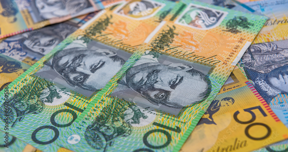 National currency. Colorful australian dollar banknotes on wooden table close up