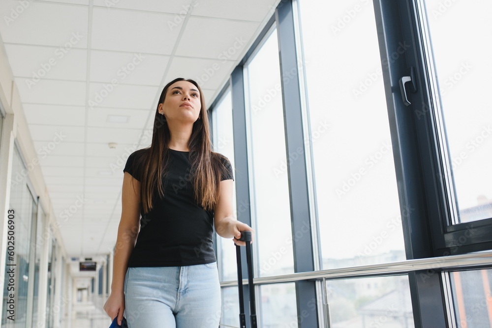 Pretty young female passenger at the airport Pretty young female passenger at the airport